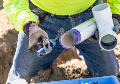 Plumber working on plumbing pipes in Peoria IL