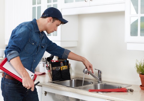 Man Completing Plumbing Service in Peoria IL