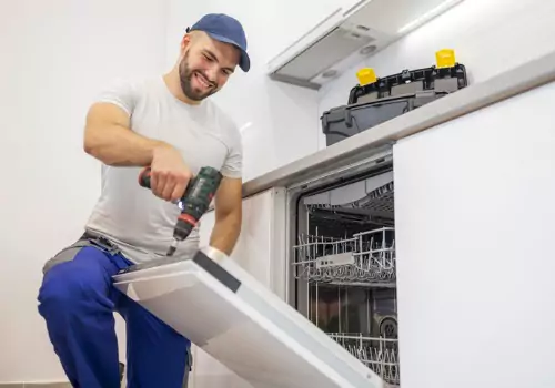 A plumber is seen at work. Reading Plumbing is a plumber near me. 
