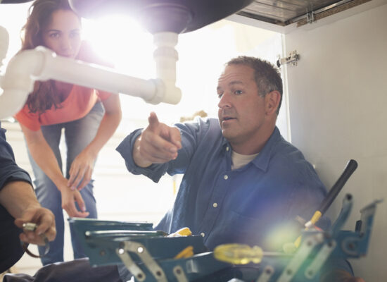 Best Residential Plumber Peoria IL, Plumbers working on pipes under sink